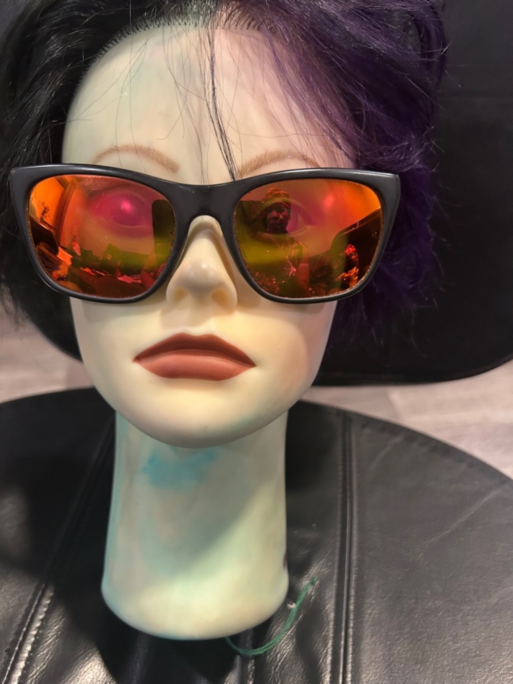 Revo Black Frame Sunglasses with Orange-Red Mirrored Lenses lens have scratches